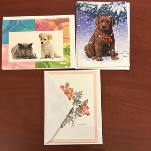 Set of blank notecards displaying animals, florals, landscapes.